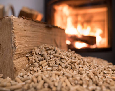 Wood stove heating with in foreground wood pellets - economical heating system concept